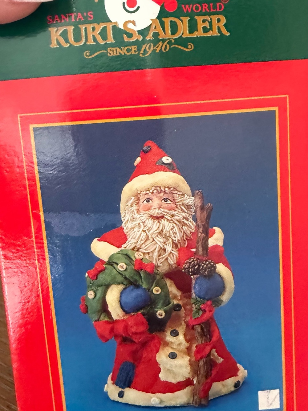 Red Santa Figurine with Green Wreath